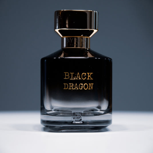 A bottle of Byron Parfums Black Dragon 75ml Extrait De Parfum, from the brand Byron Parfums, placed elegantly on a table.