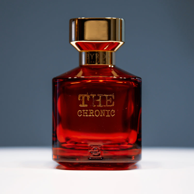 Load image into Gallery viewer, A bottle of Byron Parfums Parfums The Chronic 75ml Extrait De Parfum by Byron Parfums sitting on a table.
