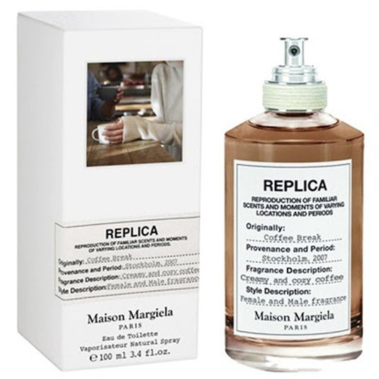 A bottle of Mason Margiela REPLICA Coffee Break 100ml Eau De Toilette fragrance in front of a box.