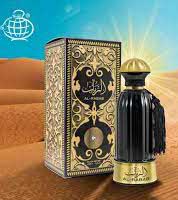 A bottle of Fragrance World Al-Rabab 100ml Eau De Parfum by Dubai Perfumes in the desert.