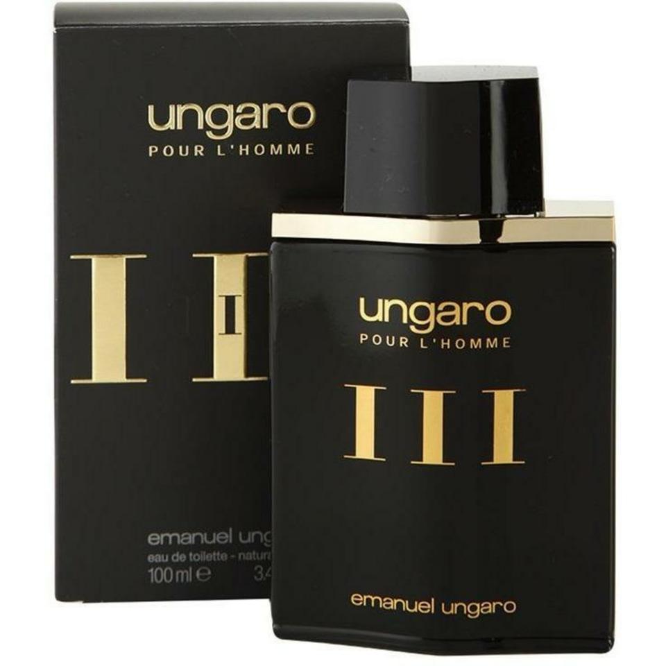 A black Ungaro pour L’Homme III 100ml EDT bottle is displayed in front of its matching black and gold box, highlighting this refined men’s fragrance by Ungaro.