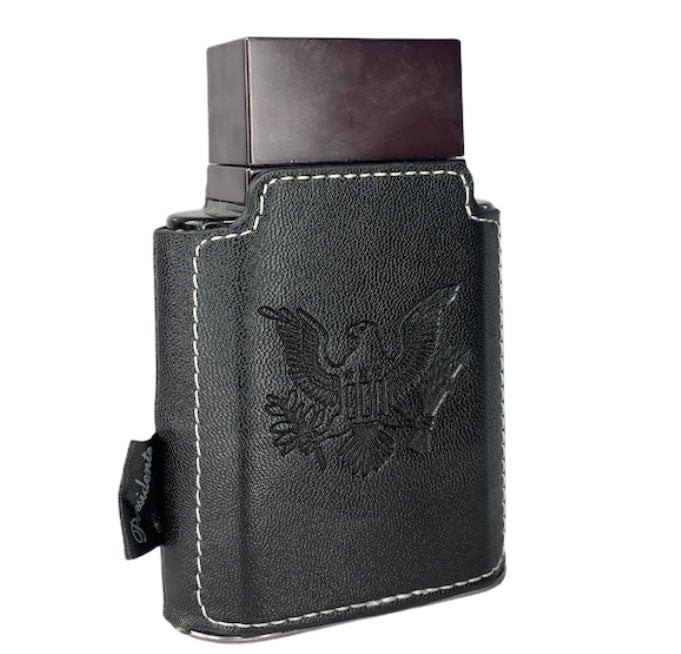 Load image into Gallery viewer, A black leather case with an eagle on it, designed to hold and protect the Emper Presidente Pour Homme 100ml Eau De Parfum fragrance by Emper, an exquisite Eau De Parfum featuring captivating notes of Amber Foug.
