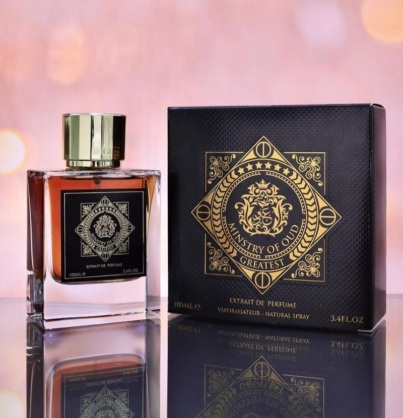 Load image into Gallery viewer, A bottle of Paris Corner Ministry of Oud Greatest 100ml Extrait de Perfume from Dubai Perfumes sitting on a table next to a box.
