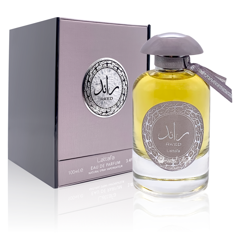 Load image into Gallery viewer, A bottle of Lattafa Ra&#39;ed 100ml Eau de Parfum by Dubai Perfumes in front of a box.

