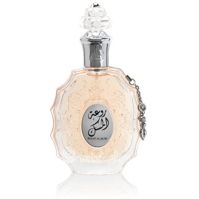 Load image into Gallery viewer, A Lattafa Rouat Al Musk 100ml Eau de Parfum bottle with arabic writing on it.
