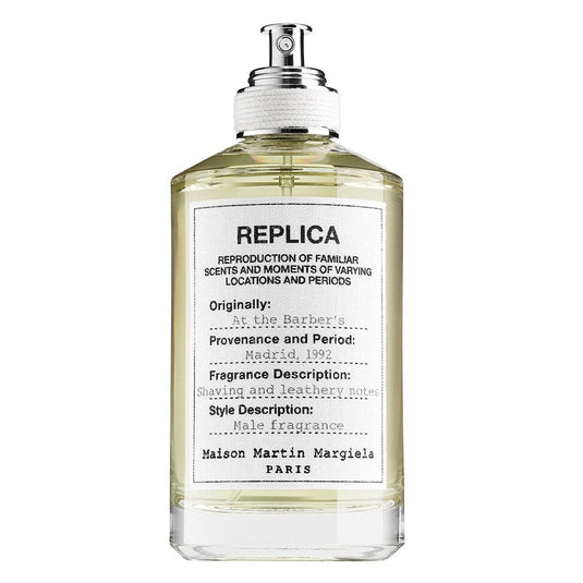 A 100ml bottle of Maison Martin Margiela REPLICA At The Barber's fragrance, a replica perfume for both men and women, displayed on a white background.