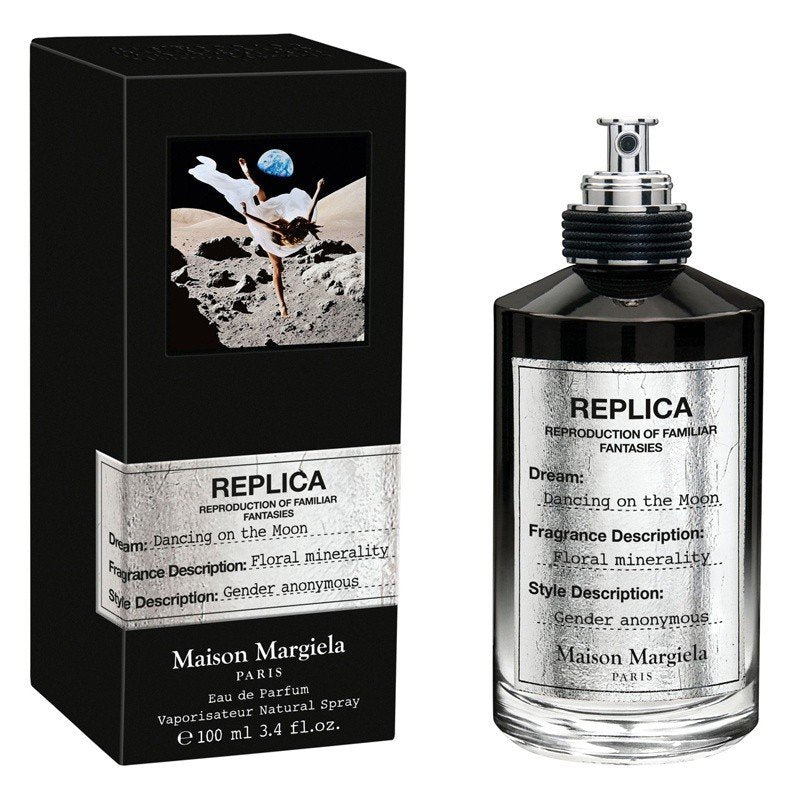 Load image into Gallery viewer, A bottle of Maison Martin Margiela Replica Dancing On The Moon 100ml Eau De Parfum with a box next to it.
