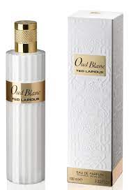 A bottle of Ted Lapidus Oud Blanc 100ml Eau De Parfum next to a box.