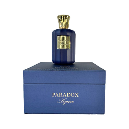 A bottle of Paris Corner Paradox Azuree 100ml Eau De Parfum from Paris Corner called Paradox Cologne sits on top of a blue box.