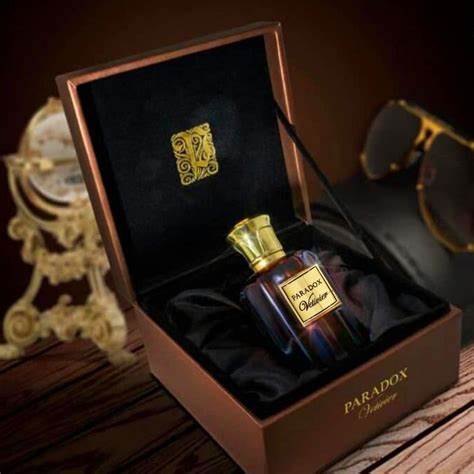 Load image into Gallery viewer, A unique scent of Paris Corner Paradox Vetivier 100ml Eau De Parfum for men and women, contained in a bottle of Dubai Perfumes, elegantly presented in a box resting on a table.
