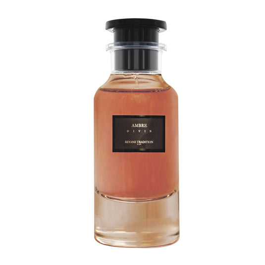 Reyane Tradition Ambre Divin 85ml EDP, a bottle of perfume with a pink bottle on a white background.