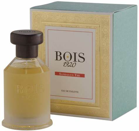 A bottle of Bois 1920 Sandalo e The 100ml Eau De Toilette, a woody aromatic perfume, in front of a box, suitable for both men and women.