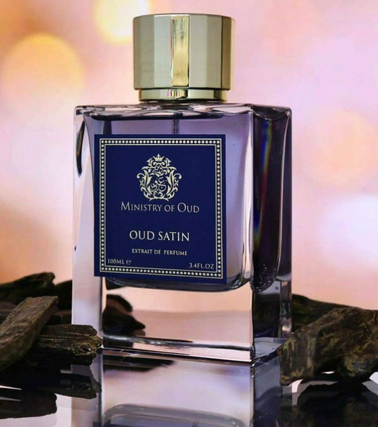 A bottle of Paris Corner Ministry of Oud Oud Satin 100ml Extrait de Perfume on a table.