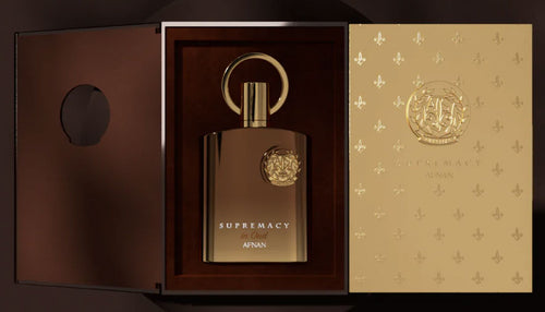 A bottle of Afnan Supremacy in Oud 100ml Extrait de Parfum in a wooden box from Rio Perfumes.
